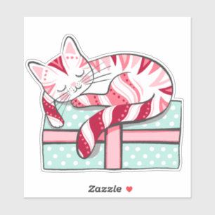 Sticker Chat couché sur un cadeau de Noël