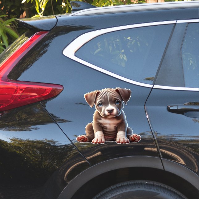 Sticker Chiot avec yeux bleus assis et regardant Innocent (Coté voiture)
