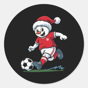 Sticker Rond Bonhomme de neige de Noël jouant au football joueu