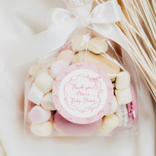 Sticker Rond Cadre ondulé dessiné à la main rose avec un nœud d