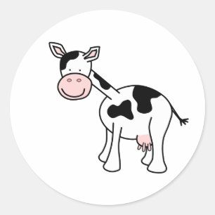 Sticker Rond Caricature de vache noire et blanche.