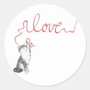 Sticker Rond Chat mignon avec ruban rouge
