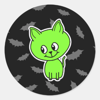 Sticker Rond Chat vert Éffrayant avec chauves-souris.