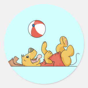 Sticker Rond Chien jouant avec des tee-shirts et des cadeaux de