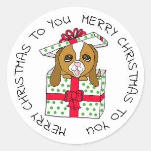 Sticker Rond Chiot doux dans la boîte-cadeau de Noël avec l'a