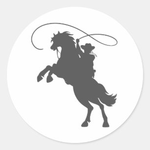 Sticker Rond cowboy lançant de l' équitation de lasso élevan
