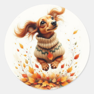 Sticker Rond Dachshund jouant dans les feuilles d'automne
