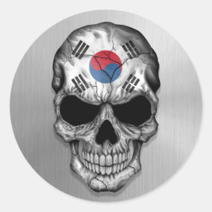 Sticker Rond Drapeau de la Corée du Sud sur un crâne en acier