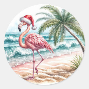 Sticker Rond Flamant rose de Noël sur une plage