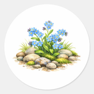 Sticker Rond Fleurs de myosotis à l'aquarelle près des rochers