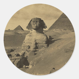Sticker Rond Hommes et chameaux sur la patte du Sphinx, Pyramid
