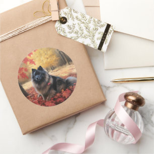 Sticker Rond Keeshond dans les feuilles d'automne qui tombent i