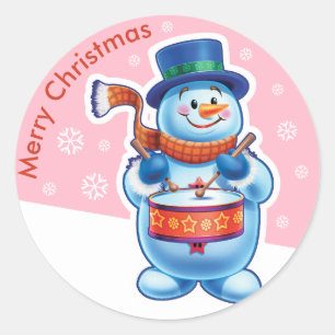 Sticker Rond L'autocollant rose de Noël Snowman batteur.