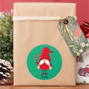 Sticker Rond Lutin de Noël tenant un bâton de bonbon