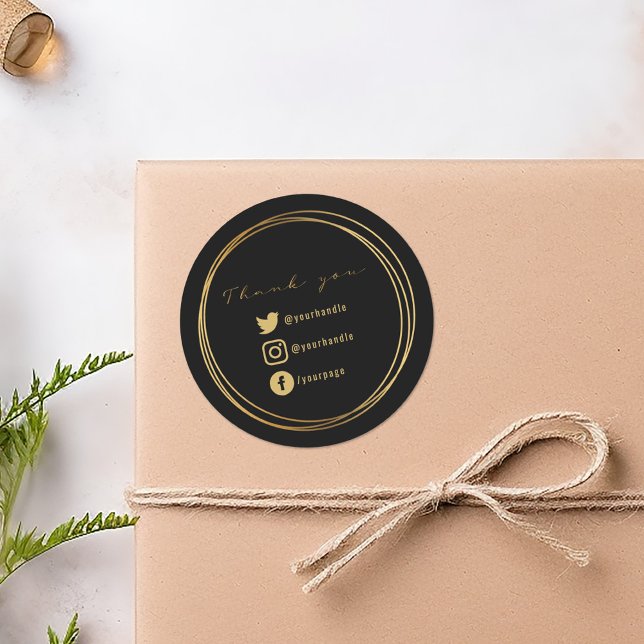 Sticker Rond Merci pour votre achat, noir et or (Black round sticker with gold script, double circle frame, and social media icons.)