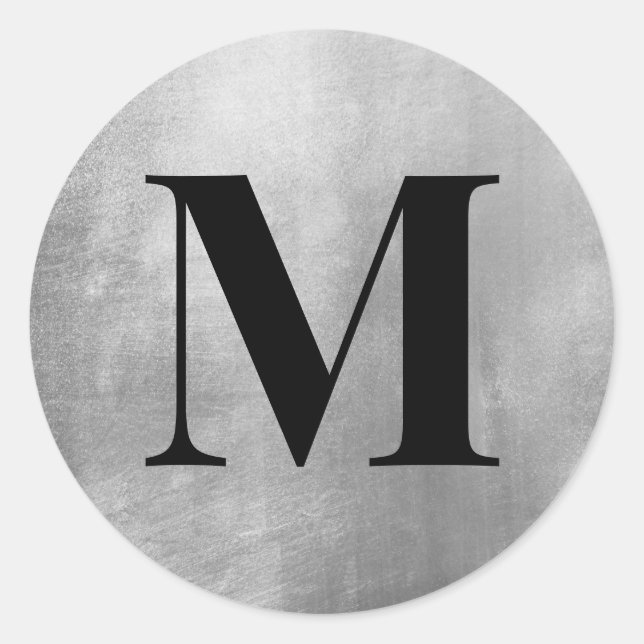 Sticker Rond Monogramme noir sur feuille faux argent (Devant)