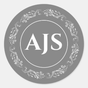 Sticker Rond Monographie circulaire en gris et blanc.