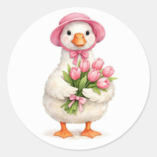 Sticker Rond Oie blanche tenant un bouquet de tulipes roses