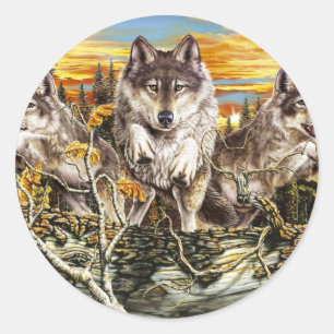 Sticker Rond Pack de loups sautant sur un bûcher
