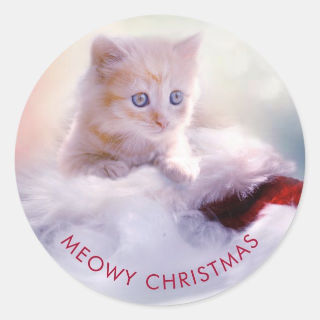 Sticker Rond Petit Kitten reposant sur un chapeau de Noël Meowy (Devant)