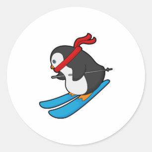 Sticker Rond Pingouin comme skieur avec ski