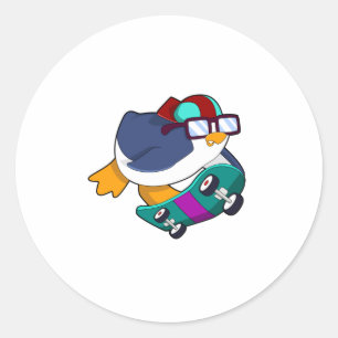 Sticker Rond Pingouin en patinage avec skateboard