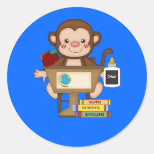 Sticker Rond Singe à l'école assis au bureau