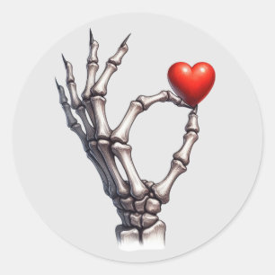 Sticker Rond Skeleton équilibre main petit coeur