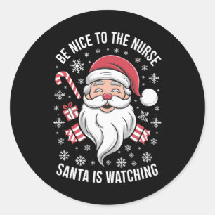 Sticker Rond Soyez gentil avec l'infirmière, le Père Noël regar