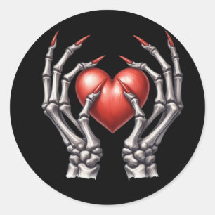 Sticker Rond Squelette mains tenant le coeur rouge
