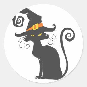Sticker Rond Un mignon chat noir dans un casquette de sorcière