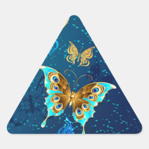 Sticker Triangulaire Papillons d'or sur un Arrière - plan bleu