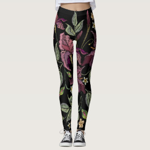 Stickereier Lila Irisschwarzer Hintergrund. Leggings