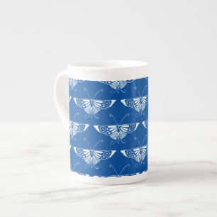 Stilvolle Art-Deco-Schmetterlinge, Kobalt blau und Prozellantasse