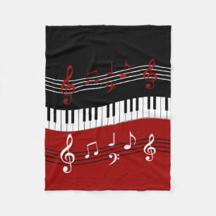 Stilvolle rote Schwarz-weiße Klavier-Schlüssel und Fleecedecke