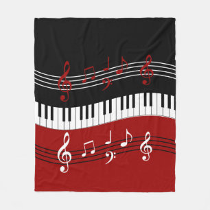 Stilvolle rote Schwarz-weiße Klavier-Schlüssel und Fleecedecke