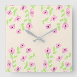 Stilvolle Uhr am Platz mit rosafarbener Blüte