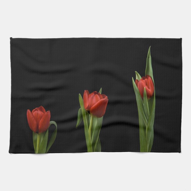 Stilvolle vibrierende rote Tulpen auf schwarzem Handtuch (Horizontal)