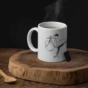 Storch mit einer Baby-Tasse Kaffeetasse