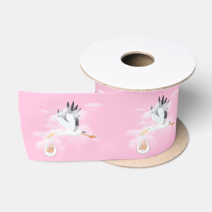 Storch und Baby auf rosa Satinband