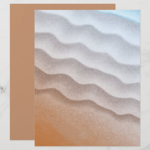 Strandsand-Wasser-Hintergrundpapier