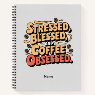 Stressgepresstes, gesegnetes und kaffeegetränktes notizbuch