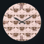 Stylized Art Deco butterfly - chocolate and peach Große Wanduhr<br><div class="desc">Reproduction of a stylized Art Deco butterfly wallpaper pattern - Dark chocolate brown on a soft peach pink background</div>