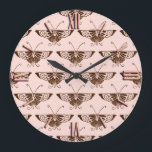Stylized Art Deco butterfly - chocolate and peach Große Wanduhr<br><div class="desc">Reproduction of a stylized Art Deco butterfly wallpaper pattern - Dark chocolate brown on a soft peach pink background</div>