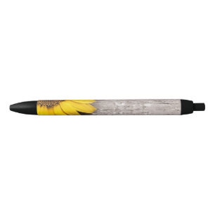Stylo Noir Tournesol sur une table en bois