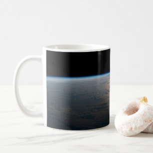 Sunglint strahlt aus einem teilweise bewölkten Süd Kaffeetasse