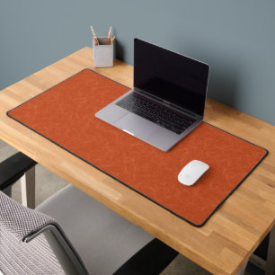 Surface orange texturée avec motif tourbillonnant