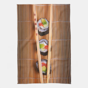 Sushi und hölzerne Essstäbchen Geschirrtuch