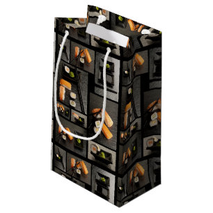 Sushisammlung auf schwarzem Hintergrund Kleine Geschenktüte