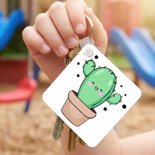 Süß lächelnder Kawaii-Baby-Kaktus in einer Vase mi Schlüsselanhänger